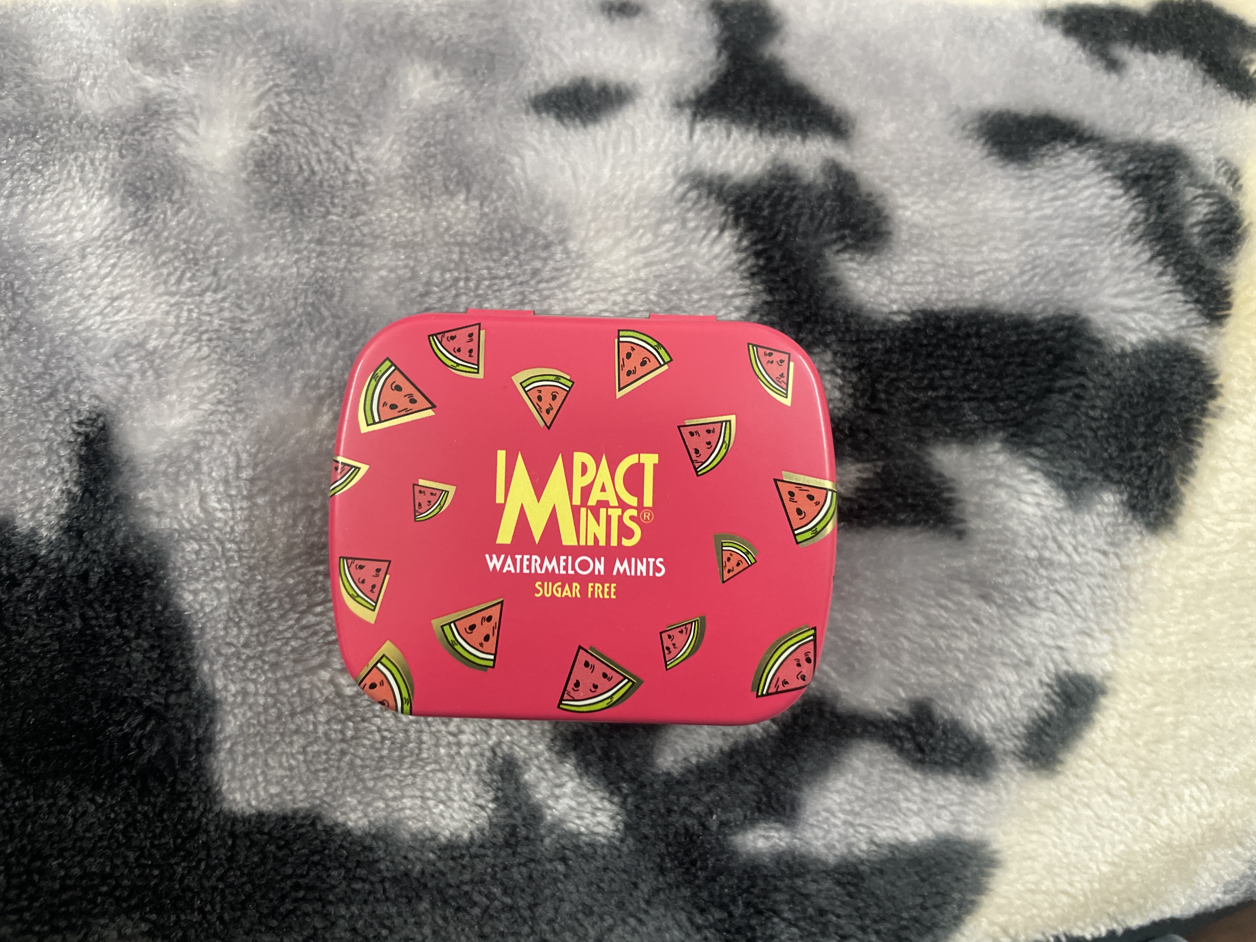 A watermelon Impact mints case